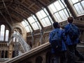 Students wearing blue jacket interestedly looking at huge Blue Whale skeleton Royalty Free Stock Photo